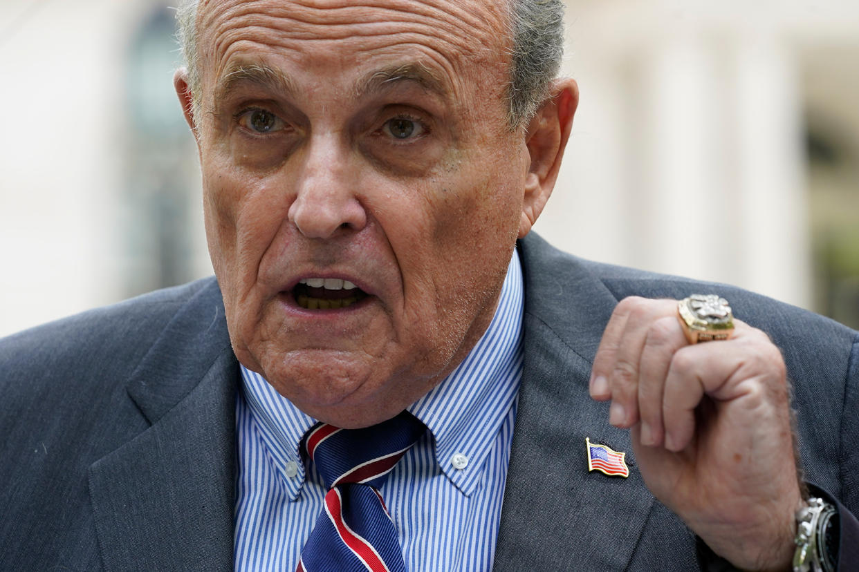 rudy-giuliani-backslap.jpg Giuliani Ethics Changes - Credit: Mary Altaffer/AP