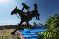 <p>Daniel Bluman of Colombia riding Apardi competes during the Jumping Individual and Team Qualifier on Day 9 of the Rio 2016 Olympic Games at the Olympic Equestrian Centre on August 14, 2016 in Rio de Janeiro, Brazil. (Photo by Christian Petersen/Getty Images) </p>