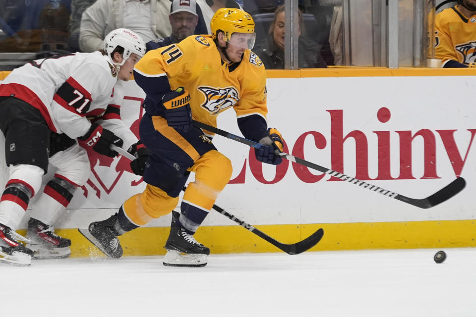 Nashville Predators center Gustav Nyquist (14) skates to the puck past Ottawa Senators center Ridly Greig (71) during the first period of an NHL hockey game Tuesday, Feb. 27, 2024, in Nashville, Tenn. (AP Photo/George Walker IV)