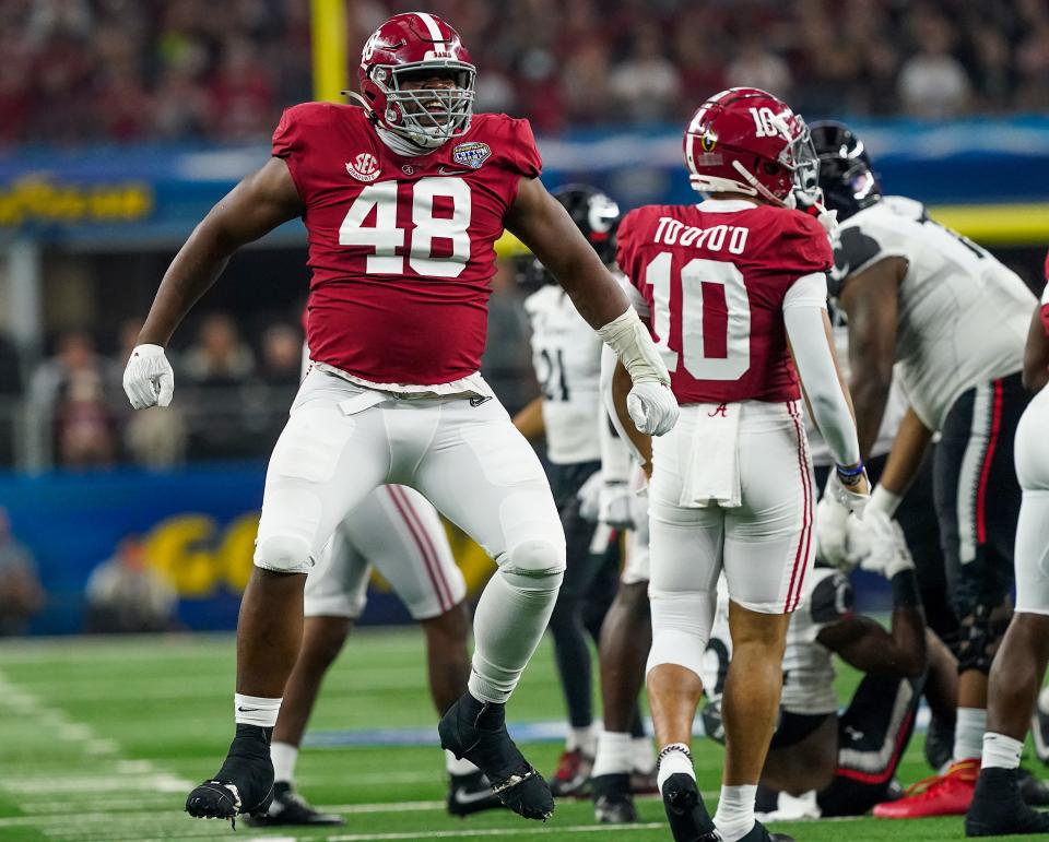 Alabama defensive lineman Phidarian Mathis (48) celebrates a tackle against Cincinnati in the 2021 College Football Playoff Semifinal game at the 86th Cotton Bowl in AT&T Stadium in Arlington, Texas Friday, Dec. 31, 2021. [Staff Photo/Gary Cosby Jr.]