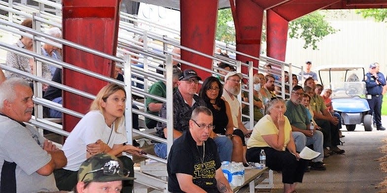 Siskiyou County residents gather at the livestock arena at the county fairgrounds Monday afternoon, Aug. 1, 2022, to hear updates on the McKinney Fire