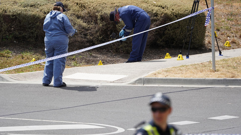 Police forensic officers search the area near where the woman’s body was found. Source: AAP