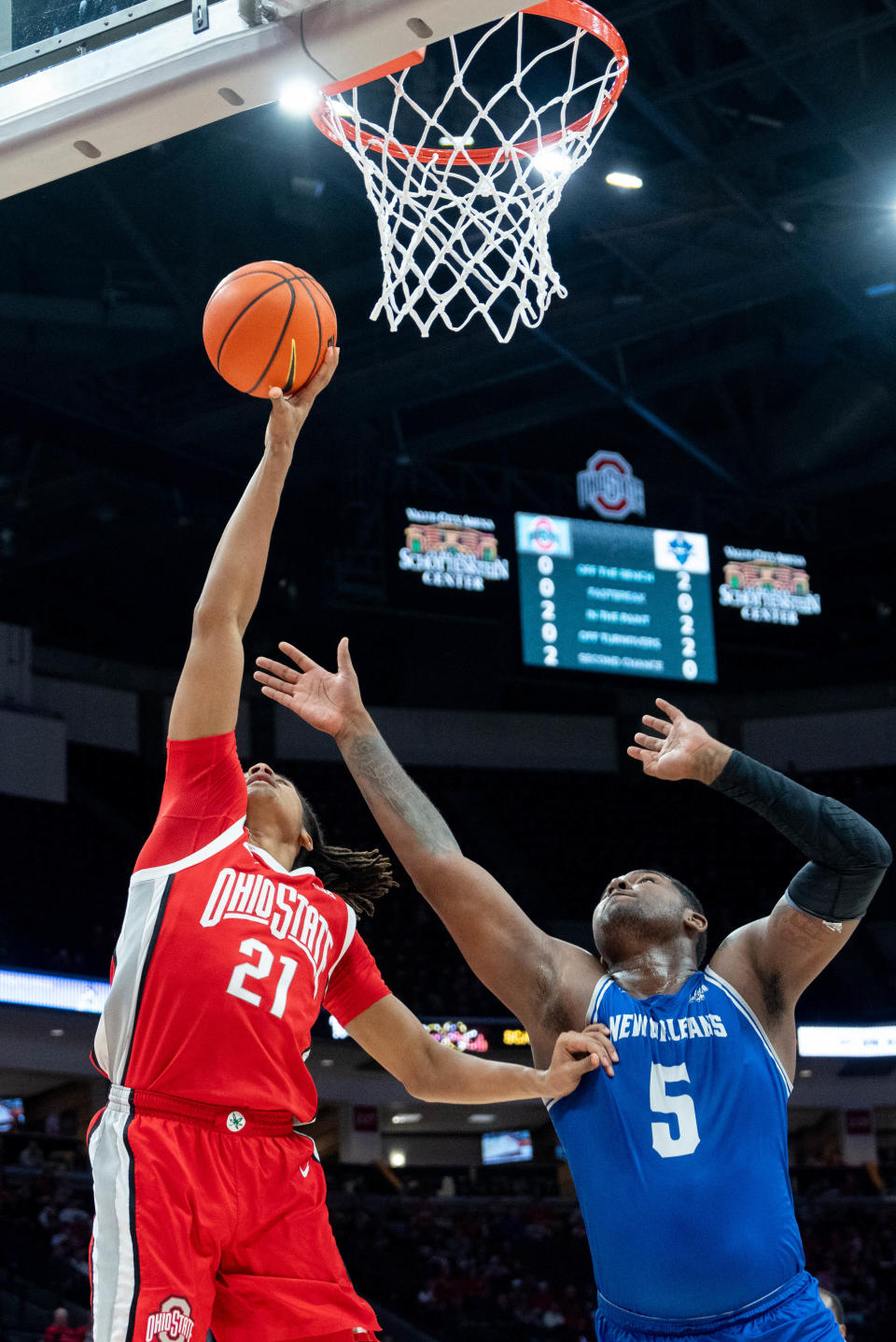 Ohio State forward Devin Royal grabs a rebound against New Orleans Privateers forward Tyson Jackson during the Buckeyes' 78-36 win on Dec. 21.