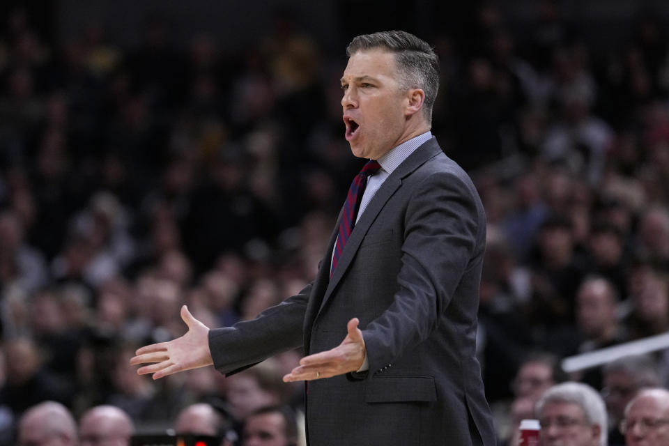 Davidson head coach Matt McKillop questions a call as his team played against Purdue in the second half of an NCAA college basketball game in Indianapolis, Saturday, Dec. 17, 2022. (AP Photo/Michael Conroy)