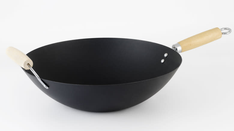 wok wooden handle white background