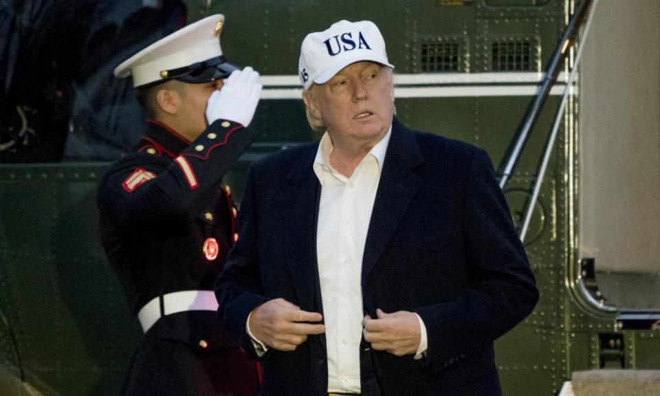 Donald Trump steps off Marine One on the South Lawn at the White House, after returning from Camp David in Maryland.