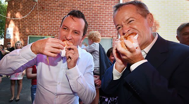 McGowan and Shorten enjoy a democracy sausage. Picture: AAP