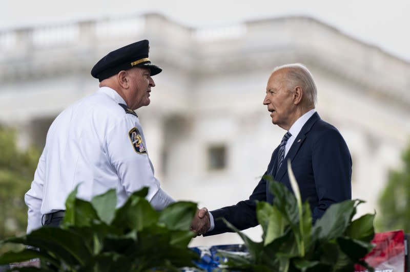 Patrick Yoes (L), President of the Fraternal Order of Police, shakes hands on Wednesday with President Joe Biden (R) during the National Peace Officers' Memorial Service at the U.S. Capitol. Photo by Bonnie Cash/UPI