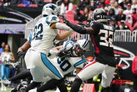 Carolina Panthers running back Chuba Hubbard (30) leaps into the end zone for a touchdown against the Atlanta Falcons during the second half of an NFL football game, Sunday, Oct. 31, 2021, in Atlanta. (AP Photo/Mark Humphrey)