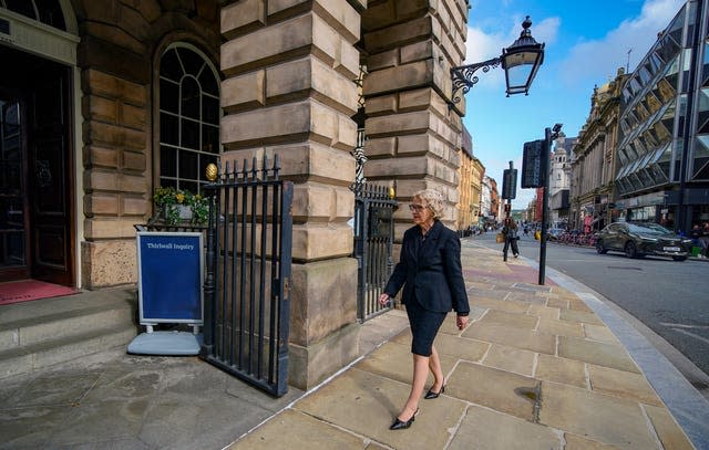 Lady Justice Thirlwall walks into the town hall