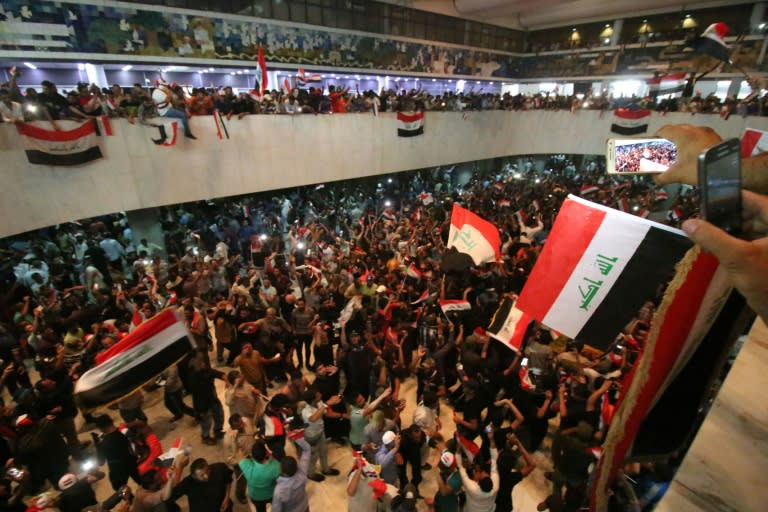 Thousands of Iraqi protesters invaded the main session hall of the parliament in Baghdad on April 30, 2016