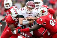 Chris Coyer #10 of the Temple Owls is sacked by Keith Brown #1 and Brandon Dunn #92 of the Louisville Cardinals during the game at Papa John's Cardinal Stadium on November 3, 2012 in Louisville, Kentucky. (Photo by Andy Lyons/Getty Images)