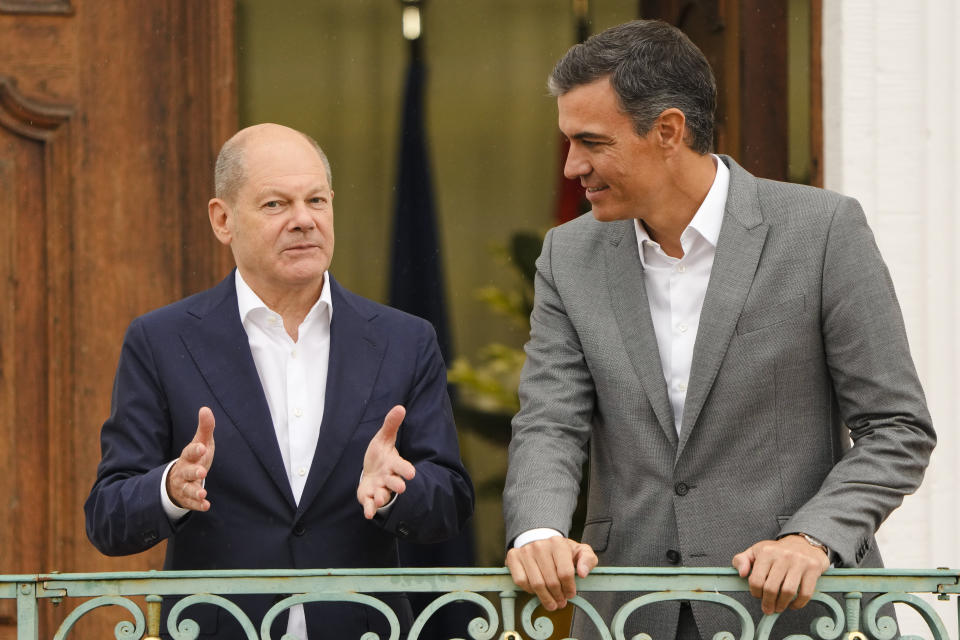 German Chancellor Olaf Scholz, left, welcomes Spanish Prime Minister Pedro Sanchez for a meeting at the German government guest house Meseberg Palce in Meseberg, north of Berlin, Germany, Tuesday, Aug. 30, 2022. (AP Photo/Markus Schreiber)