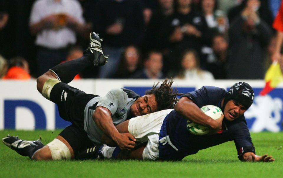 Thierry Dusautoir scores a try for France against New Zealand during the 2007 World Cup