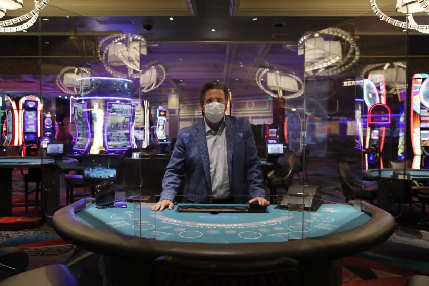 Acrylic barriers used as a coronavirus safety precaution at a blackjack table