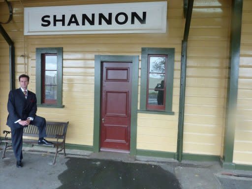 Kevin Couling standing outside weatherboard building with a sign of the town's name in Shannon. The 64th Lord of Little Neston, known as Kevin Couling to his friends, dearly wishes he could be in London to see Prince William and Kate Middleton tie the knot but says prior commitments prevented him making the trip