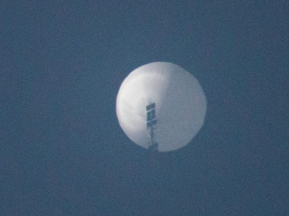 A balloon flies in the sky over Billings, Montana, on February 1, 2022.