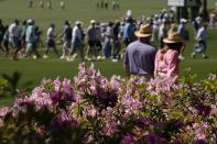 Patrons walk past Azalea's during a practice round in preparation for the Masters golf tournament at Augusta National Golf Club Monday, April 8, 2024, in Augusta, Ga. (AP Photo/George Walker IV)
