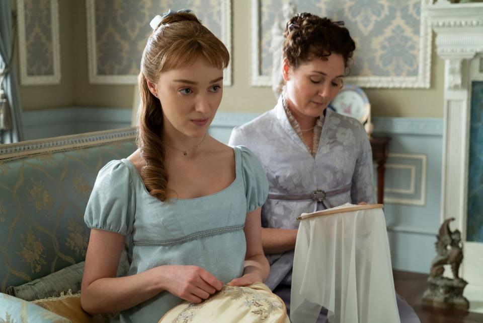 phoebe dynevor as daphne bridgerton sewing alongside ruth gemmell playing her mother in bridgerton, season 1