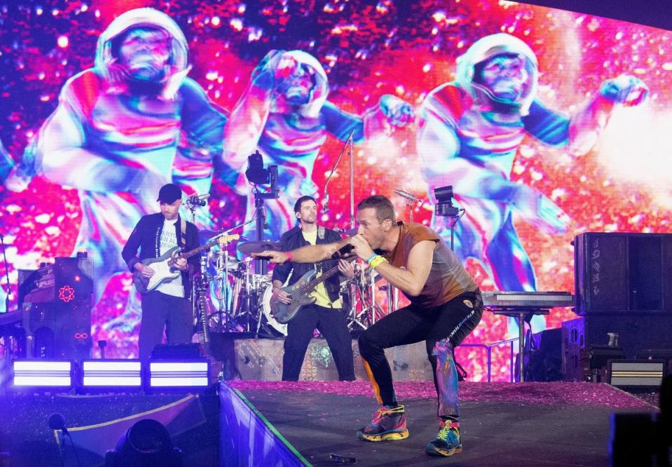 Coldplay's Chris Martin performing on stage at Wembley Stadium during their Music of the Spheres tour (Suzan Moore/PA)