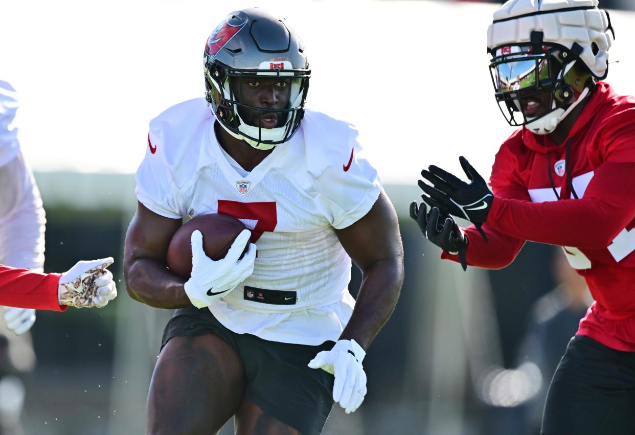 Leonard Fournette #7 of the Tampa Bay Buccaneers runs the ball during the 2022 Buccaneers Training Camp AdventHealth Training Center on July 27, 2022 in Tampa, Florida.