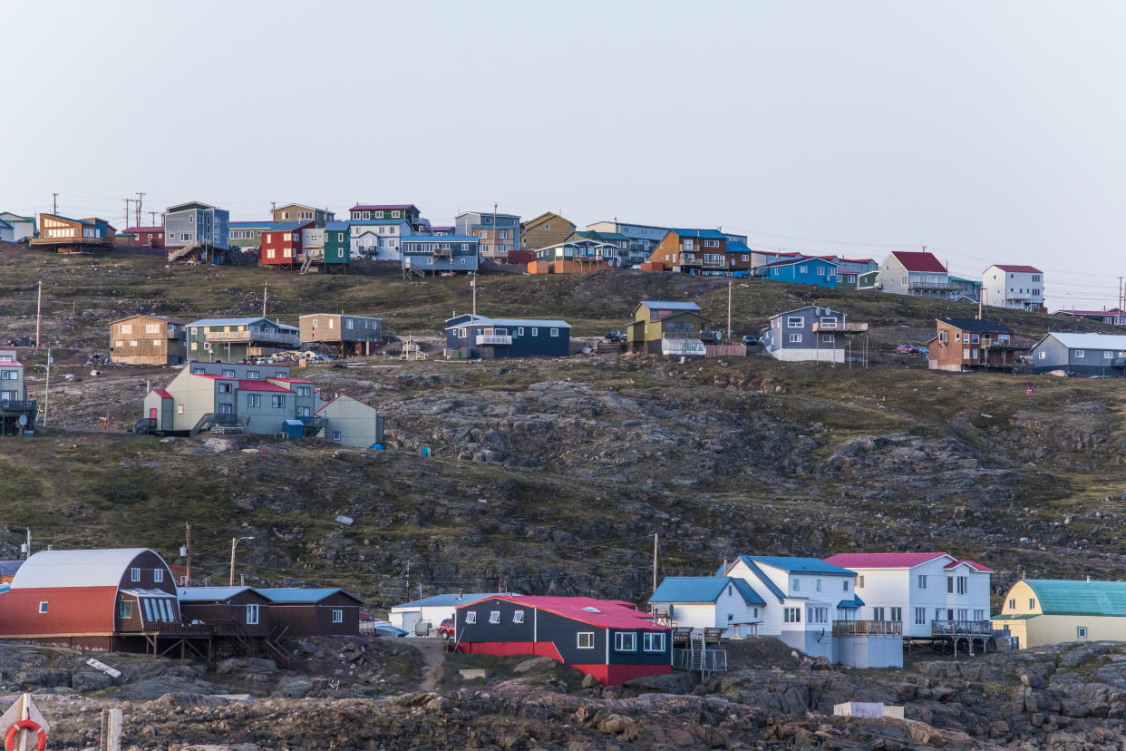 Dozens of houses perched on cliffs.