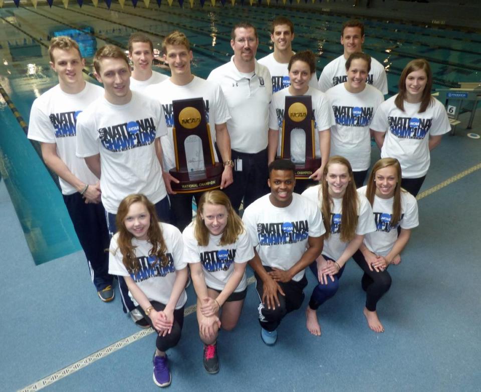 This Observer file photo, taken in 2015, shows members of the Queens’ men’s and women’s swimming teams after both won team titles at the NCAA Division II national championships to start their long streaks of dominance at that level.
