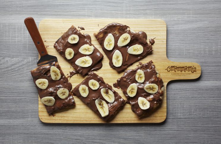 Topped with Nutella and sliced banana on a crispy brown pizza base, the Pizza Nutella is a treat for dessert-lovers