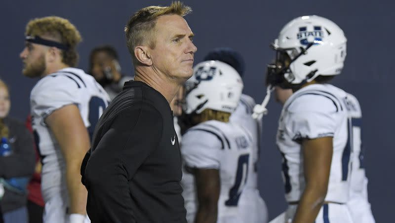 Utah State head coach Blake Anderson watches as players walk off the field after being defeated by James Madison in an NCAA college football game Saturday, Sept. 23, 2023, in Logan, Utah.