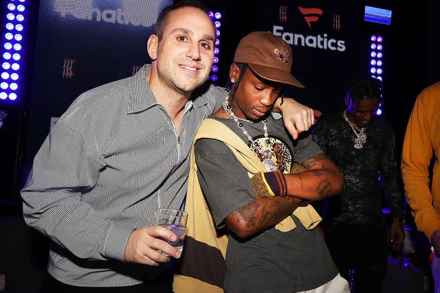 Shareif Ziyadat/FilmMagic Michael Rubin and Travis Scott attend Fanatics Super Bowl Party on Feb. 12, 2022.