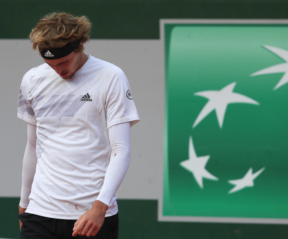 Germany's Alexander Zverev reacts after missing a shot against Italy's Jannik Sinner in the fourth round match of the French Open tennis tournament at the Roland Garros stadium in Paris, France, Sunday, Oct. 4, 2020. (AP Photo/Michel Euler)