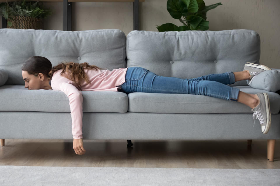 woman exhausted on the couch