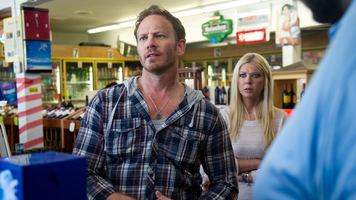 Fin Shepard (Ian Ziering) and April Wexler (Tara Reid) are an estranged husband and wife in 2013's Sharknado. (Photo: Everett Collection)