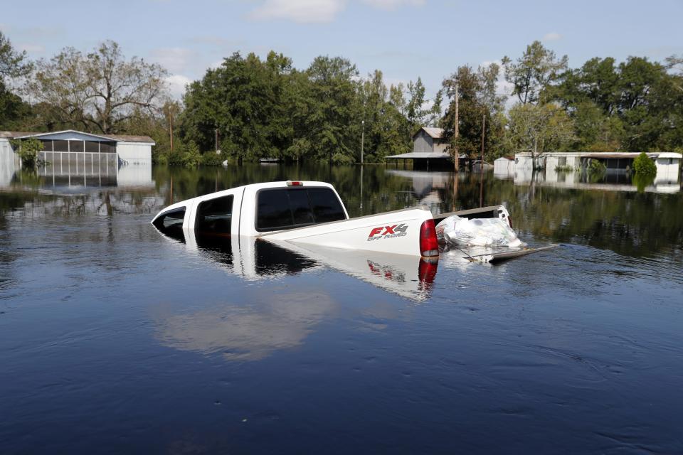 A submerged truck sits in floodwaters in the aftermath of Hurricane Florence on Sept. 21, 2018, in Nichols, S.C. Nichols suffered devastating flooding during Hurricane Matthew 2016 and Florence in 2018.