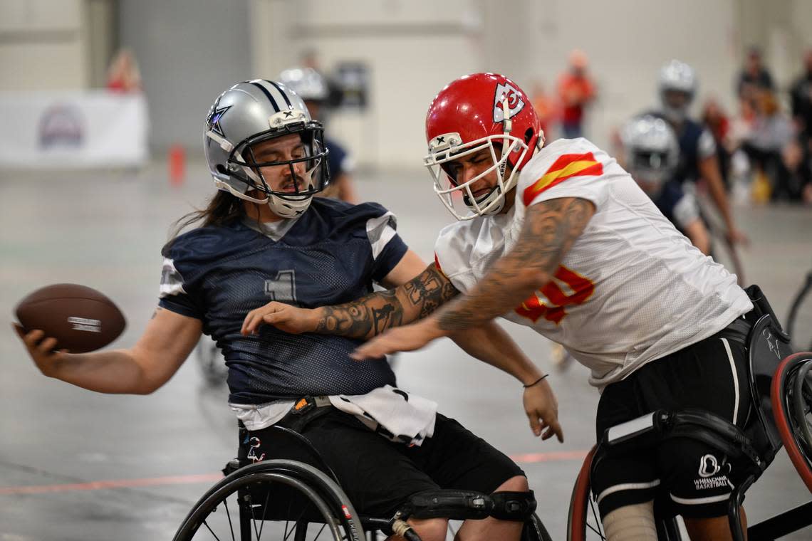 Dallas Cowboys player Zach Blair (1) makes a catch in front of Kansas City Chiefs player Alex Nguyen (40) during the USA Wheelchair Football League Championship, a program of Move United, Tuesday, Feb. 6, 2024 in Dallas, Texas. Reed Hoffmann/Move United