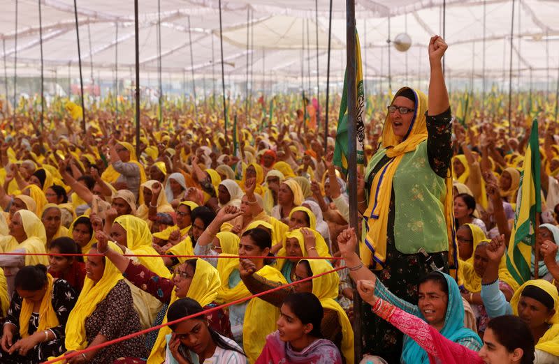 Women farmers attend a protest against farm laws on the occasion of International Women's Day at Bahadurgar