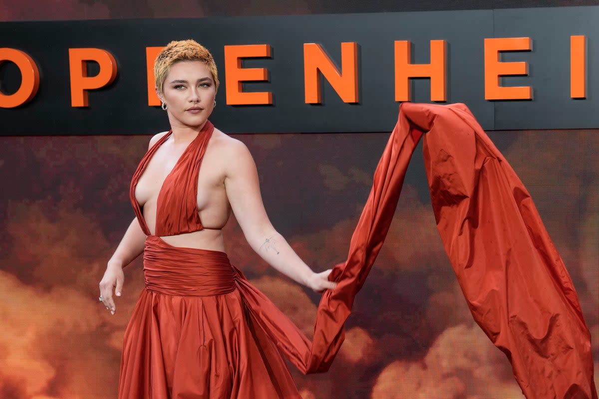 Florence Pugh poses for photographers upon arrival at the premiere of Oppenheimer, 13 July 2023 (Scott Garfitt/Invision/AP)