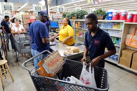 Shoppers at a local supermarket are seen before the arrival of Hurricane Dorian in Marsh Harbour