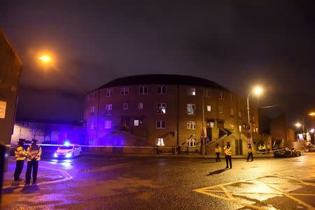 Police officers attend to the scene of a shooting at Poplar Row in Dublin, Ireland February 8, 2016. REUTERS/Clodagh Kilcoyne