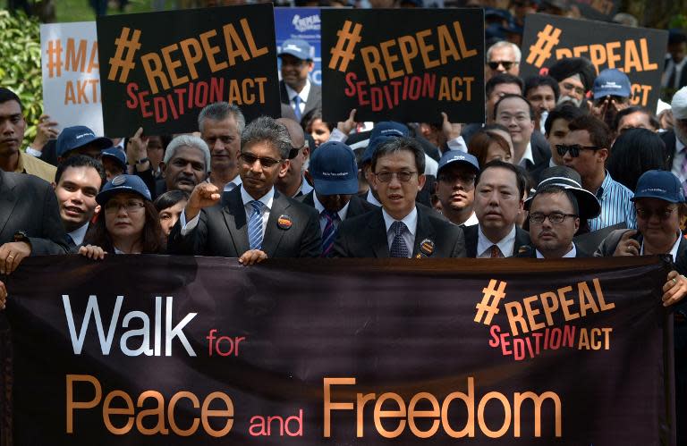 Malaysian Lawyers march toward the Parliament house in Kuala Lumpur on October 16, 2014 during a rally to repeal the Sedition Act