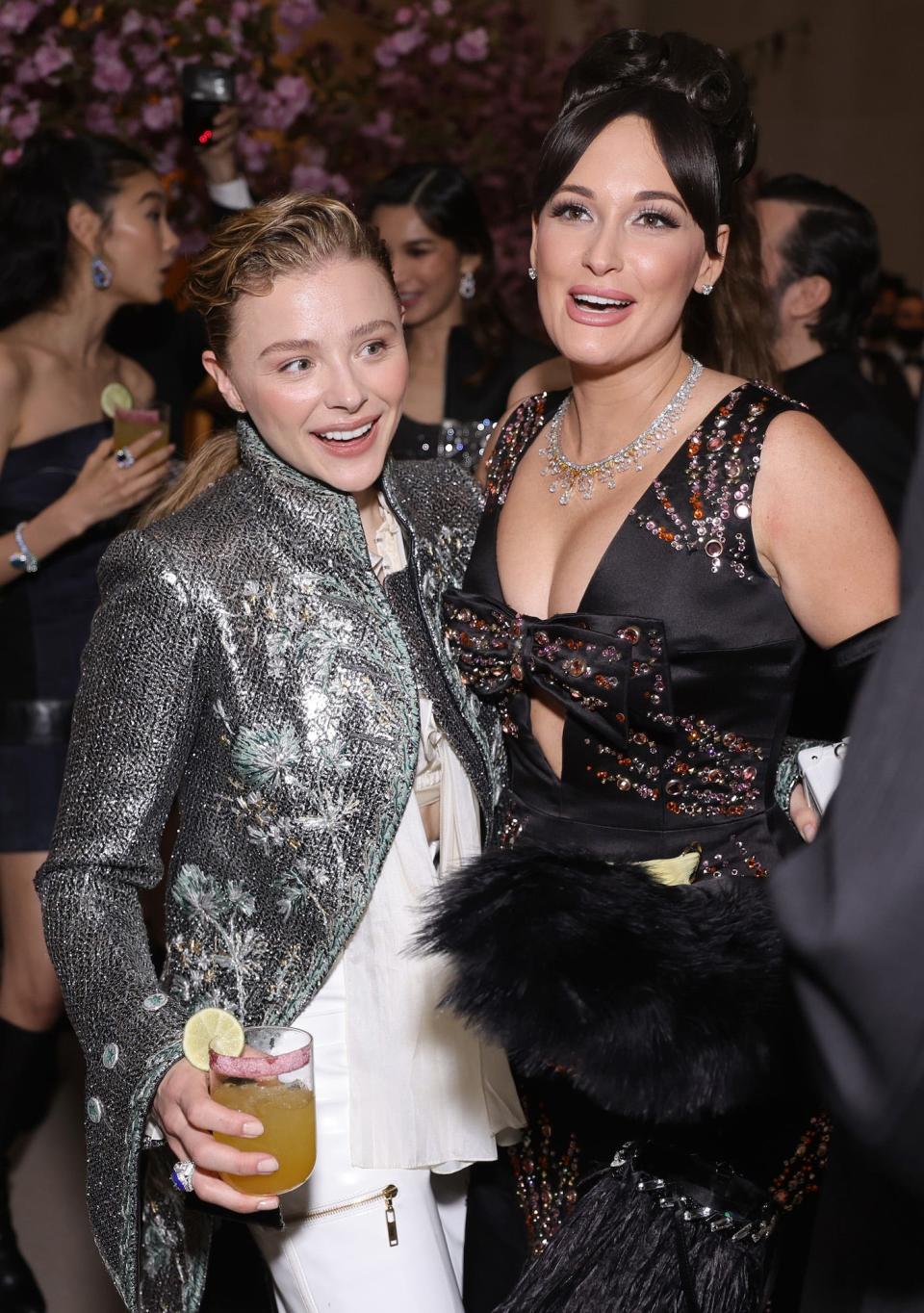 Chloë Grace Moretz and Kacey Musgraves hug at the Met Gala on May 2, 2022.