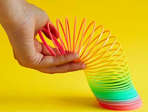 <p><strong>JA-RU</strong></p><p>amazon.com</p><p><strong>$4.98</strong></p><p>Everyone loves a slinky! It's a classic kids' toy, but adults can also use it to help them de-stress. Th seller describes this fidget toy as a great way to stimulate your child's color vision and hand movement. </p>
