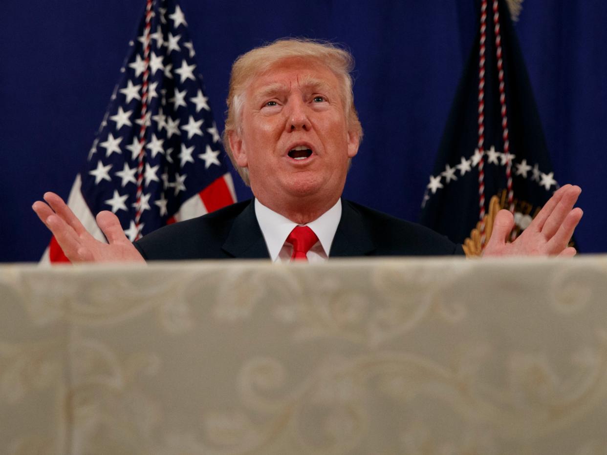 Donald Trump explains his transgender ban to reporters at Trump National Golf Club in Bedminster, New Jersey on, Aug. 10, 2017: Evan Vucci/AP Photo