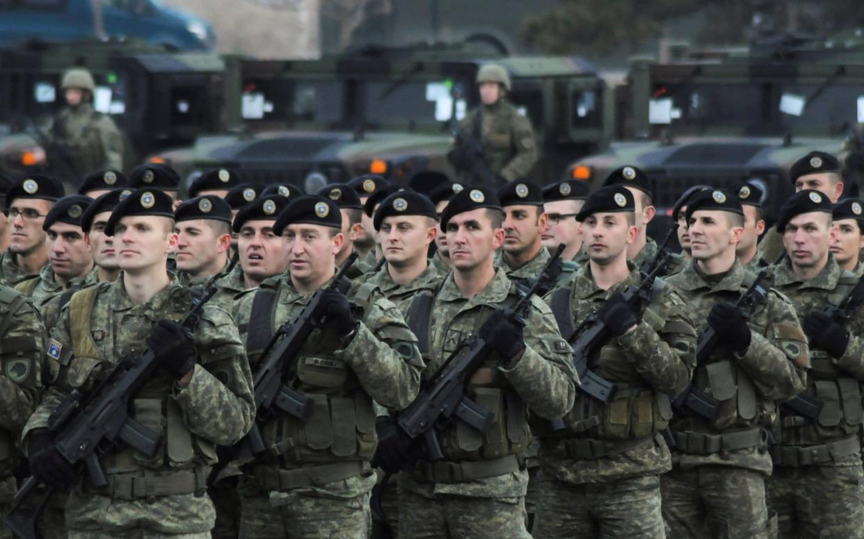 Members of Kosovo's security forces parade a day before parliament's vote on whether to form a national army, in Pristina, Kosovo, December 13, 2018  - REUTERS