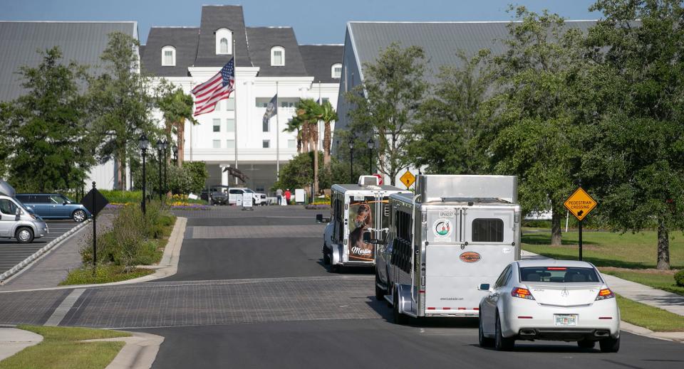 Horsemen and horsewomen arrive for a Paso Fino show at the World Equestrian Center on May 20. WEC has a 248-room hotel and 25 barns with almost 3,000 stalls.