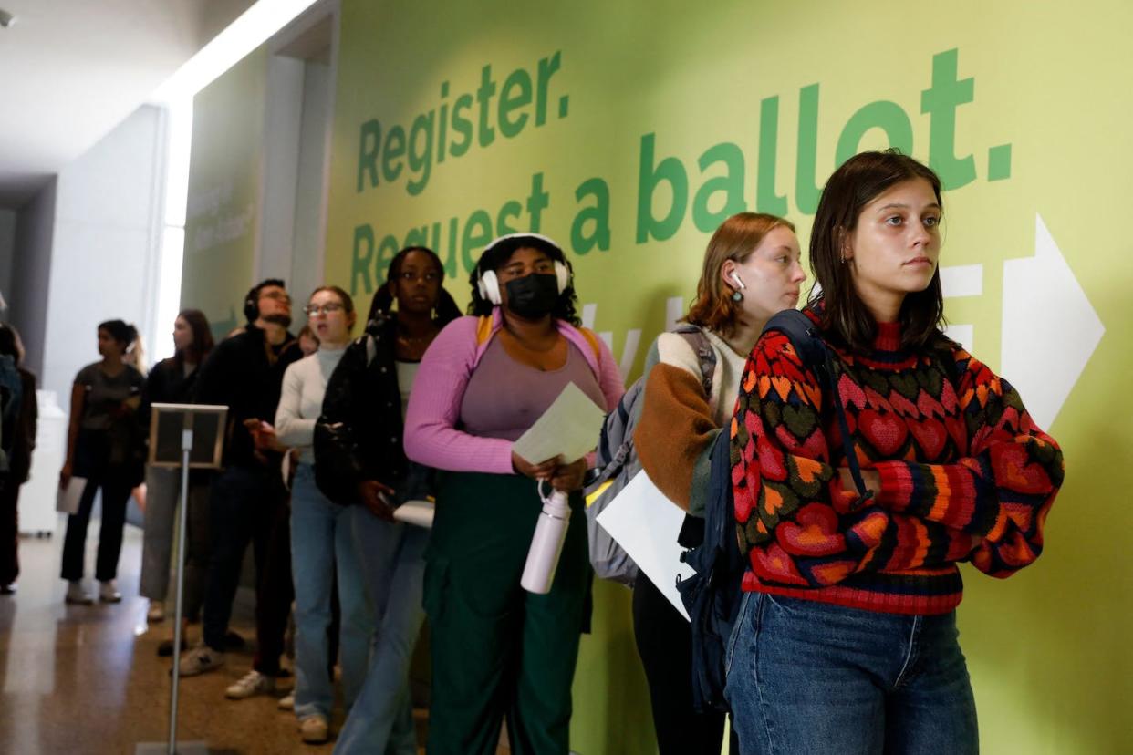 People line up to cast early ballots during the 2022 election at the University of Michigan. <a href="https://media.gettyimages.com/id/1244584306/photo/us-vote-election.jpg?s=1024x1024&w=gi&k=20&c=MsAi1cvASg5oWW9Xv5x2H6xYH6NmIWpjC-QIUQqEQzY=" rel="nofollow noopener" target="_blank" data-ylk="slk:Jeff Kowalsky/AFP via Getty Images;elm:context_link;itc:0;sec:content-canvas" class="link ">Jeff Kowalsky/AFP via Getty Images</a>
