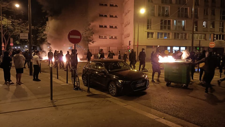 Protesters burn garbage bins and block a street during a protest in Paris on June 29. - Fiachra GIBBONS/AFP/Getty Images