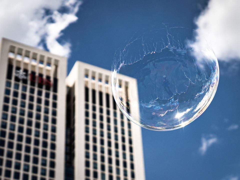 Soap bubble bursts in midair