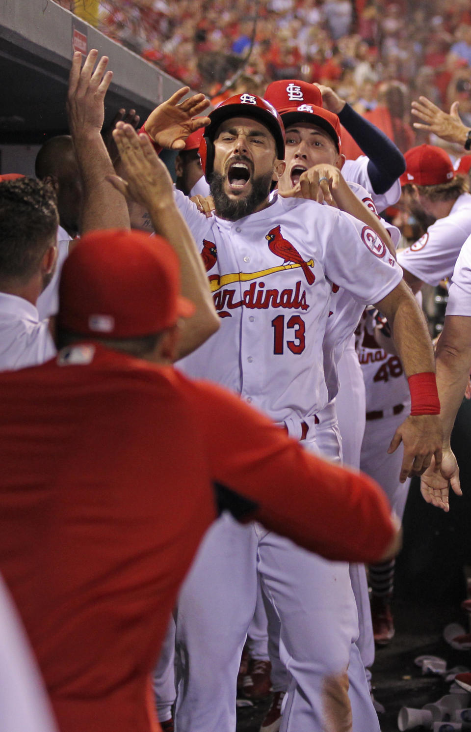 St. Louis Cardinals' Matt Carpenter (13) celebrates with teammates after hitting a three-run home run in the eighth inning of a baseball game against the Washington Nationals, Monday, Aug. 13, 2018, in St. Louis. The Cardinals defeated the Nationals 7-6. (AP Photo/Tom Gannam)