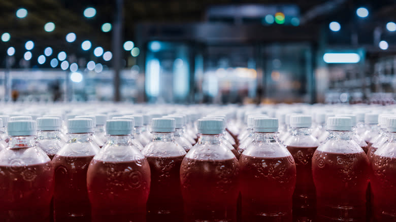 factory with bottles of red syrup